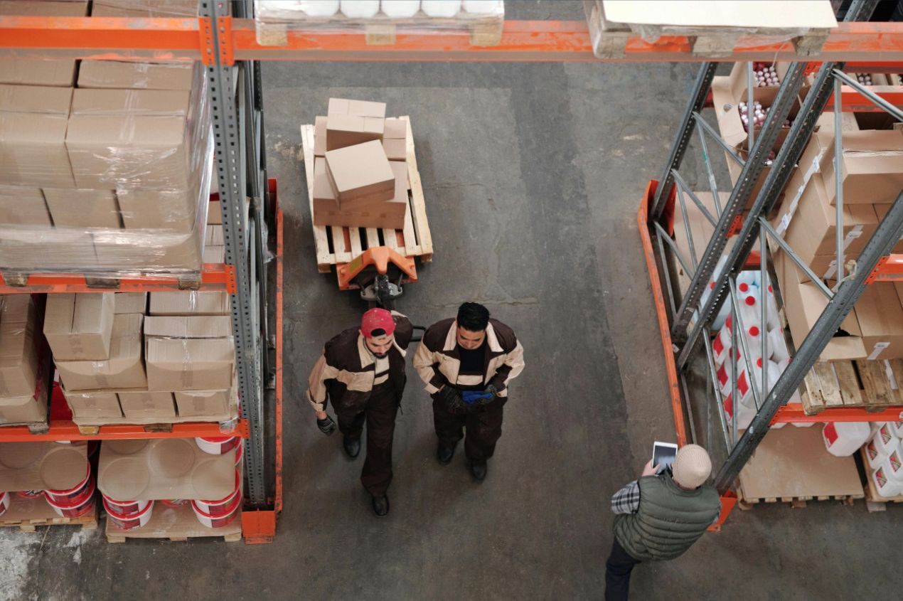 UKFM operative applying FNSKU Amazon barcodes to products for FBA compliance
