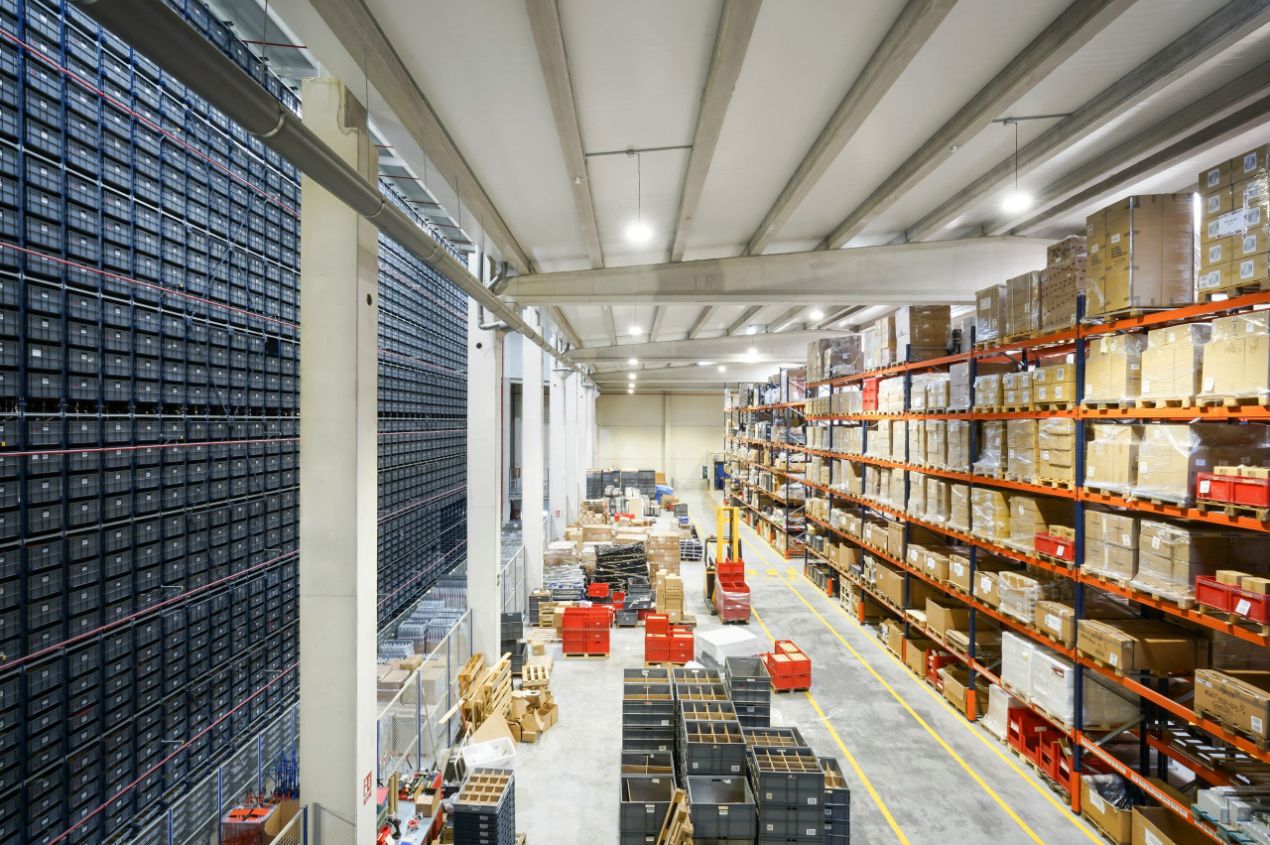 UKFM warehouse team carefully handling palletised goods in the Belvedere facility